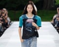 A model walks the Stella McCartney spring/summer ‘27 catwalk show during Paris fashion week wearing a T-shirt featuring a dolphin print and denim jeans.