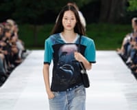 A model walks the Stella McCartney spring/summer ‘27 catwalk show during Paris fashion week wearing a T-shirt featuring a dolphin print and denim jeans.