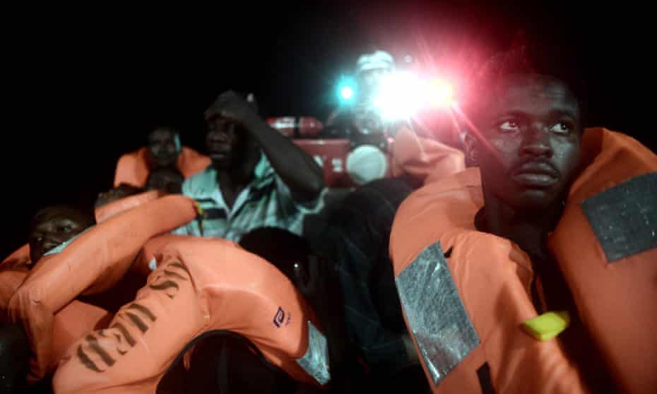 People are rescued before boarding the MS Aquarius