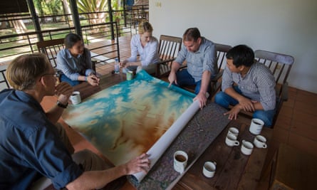 The team at Siem Reap’s École Française d’Extrême-Orient look at a map of the site.