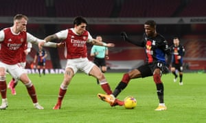 Hector Bellerin halts Zaha.