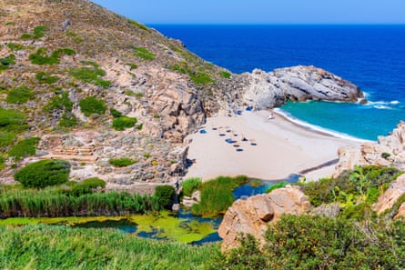 A beach and blue seas on a hot day
