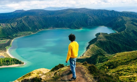 Azores, Sao Miguel, rear view of man looking at the Lagoa do Fogo