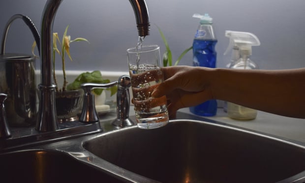 Florabela Cunha fills a glass of water from her kitchen faucet in Prince Rupert, British Columbia, Canada. Hundreds of thousands of Canadians have been unwittingly exposed to levels of lead in their drinking water.