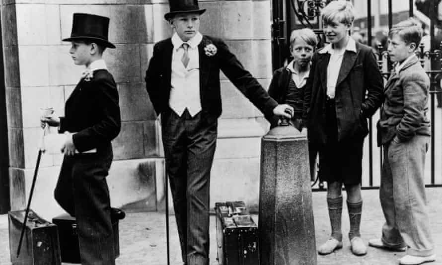 Boys in top hats watched by less well-off boys
