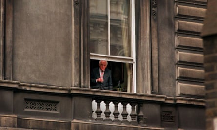 A member peers from the Garrick Club before lunch in August 1998