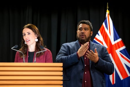 Alan Wendt signs while Prime Minister Jacinda Ardern speaks during a post cabinet press conference at Parliament on June 4, 2019 in Wellington, New Zealand.