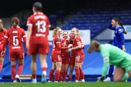Alejandra Bernabé of Liverpool celebrates with teammates her team’s second goal, an own goal by Martina Fernández of Everton