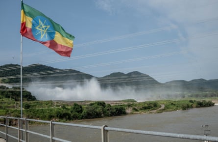 Mist and spray rises into the air from the dam