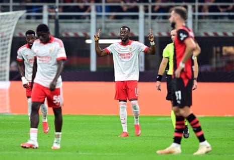 Benfica's Dodi Lukebakio celebrates after opening the scoring at Milan.