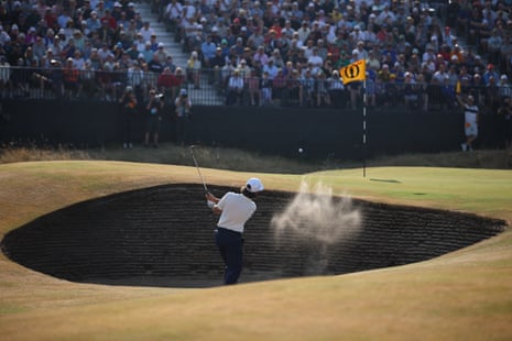 Tommy Fleetwood plays out from the bunker on the 14th.