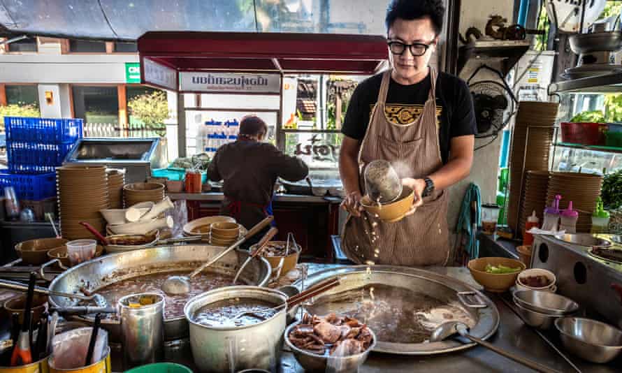 A chef prepares food at Rod Yiam a family-run noodle shop, in Chiang Mai, Thailand.