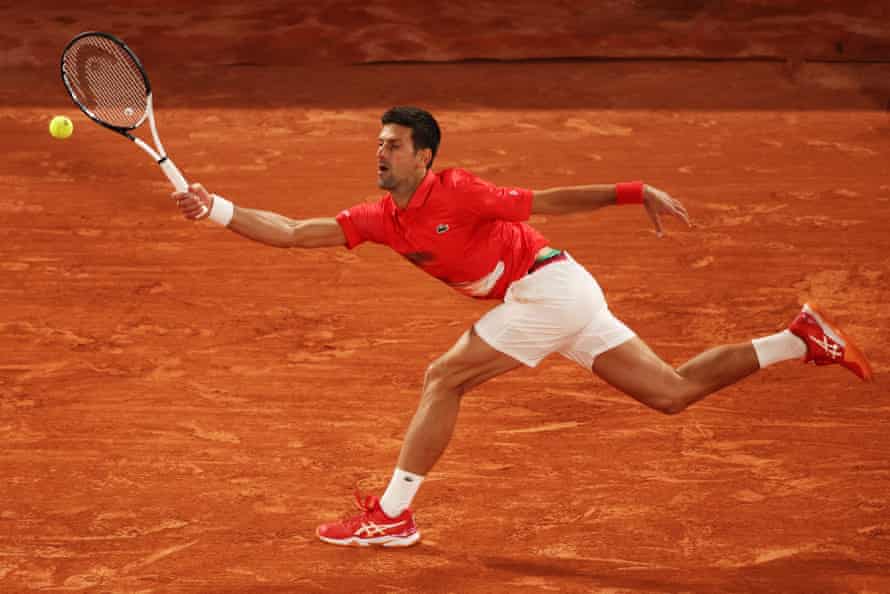 Djokovic stretches to play a forehand in the quarter-final against Nadal.