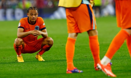 Xavi Simons, who scored the Netherlands’ early opener, slumps to the turf at full time