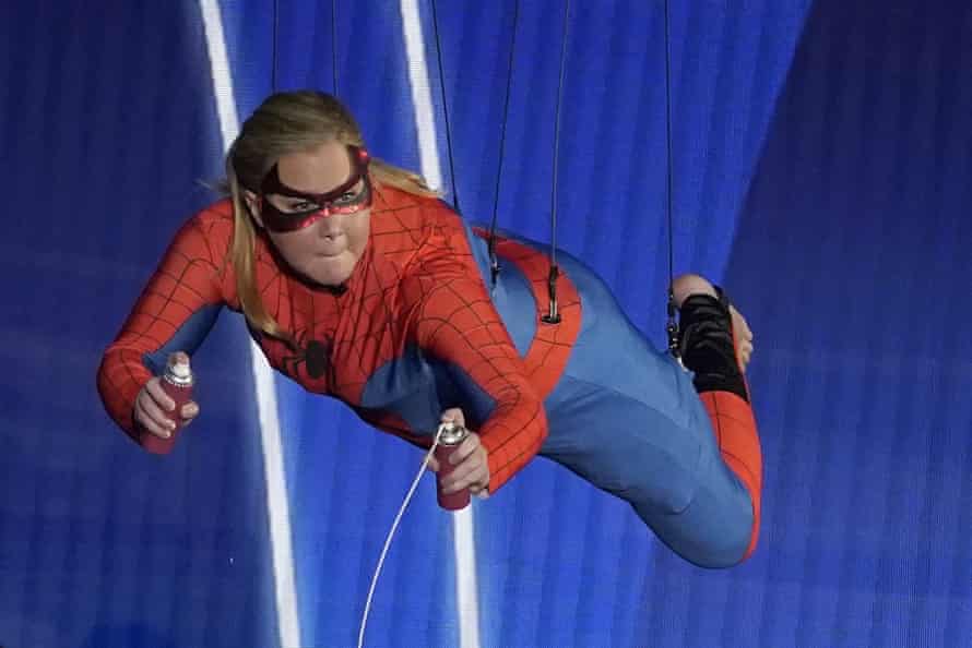 Amy Schumer appears on stage dressed as Spider-Man during the Oscars ceremony.
