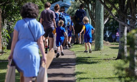 Students are seen entering school grounds for their first day back of the year in Brisbane, Monday, February 7, 2022