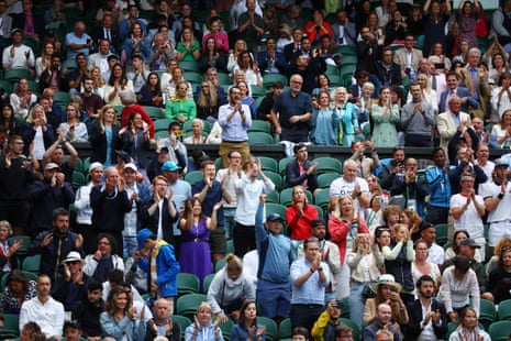 Spectators applaud Britain’s Andy Murray after he won the third set against Australia’s James Duckworth.