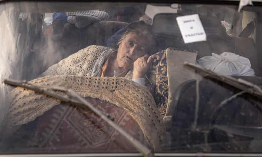 Varta, 81, from Mariupol, in the back of her family’s car after a four-day journey to an evacuation point in Zaporizhzhia for people fleeing from Mariupol, Melitopol and surrounding towns under Russian control.