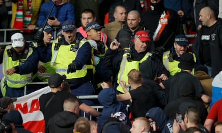 Police move into the away end at Wembley.