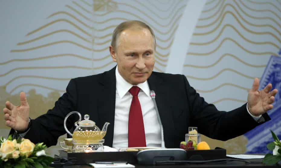 Vladimir Putin at a summit it St Petersburg.