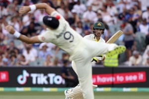 Australia’s Mitchell Starc (right) hits a ball past England’s Jimmy Anderson.