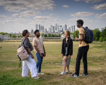 Students with Canary Wharf in the background.