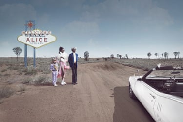 Fake (welcome sign) 2023. A man, a woman and a young girl standing by the side of a dirt road next to a white convertible and a sign. The sign looks like a typical Las Vagas sign but says ‘Welcome to fabulous Alice Springs’.