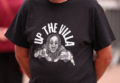 An Aston Villa fan wears a T-shirt bearing the image of Ozzy Osbourne, the local legend and Black Sabbath frontman who packed out Villa Park for a charity gig shortly before his death this summer.