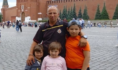 Yevhen Mezhevyi with Matvii, 13, ​and Sviatoslava (nine) and Oleksandra​ (seven)