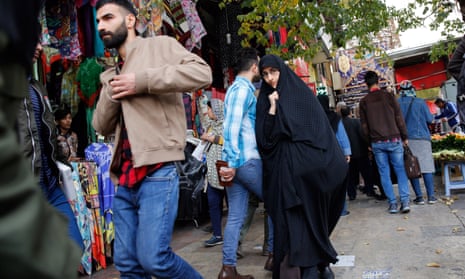 Iranians shop in a bazaar in Tehran, Iran.
