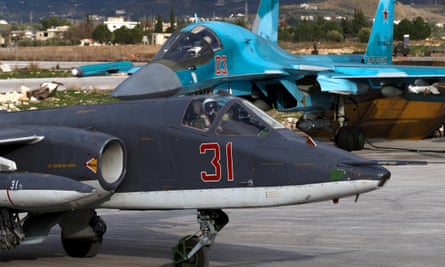 A Russian Sukhoi Su-25 jet aircraft, left, and Sukhoi Su-34 fighter bomber at the Hmeymim airbase in Latakia, Syria, in January 2016.