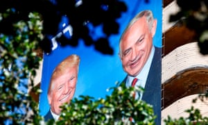 Israeli Likud party election banners hang from a building, showing Benjamin Netanyahu shaking hands with Donald Trump, in Tel Aviv. 5472.jpg?width=300&quality=85&auto=forma