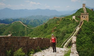 Solo woman trekking on the Great Wall Of China.