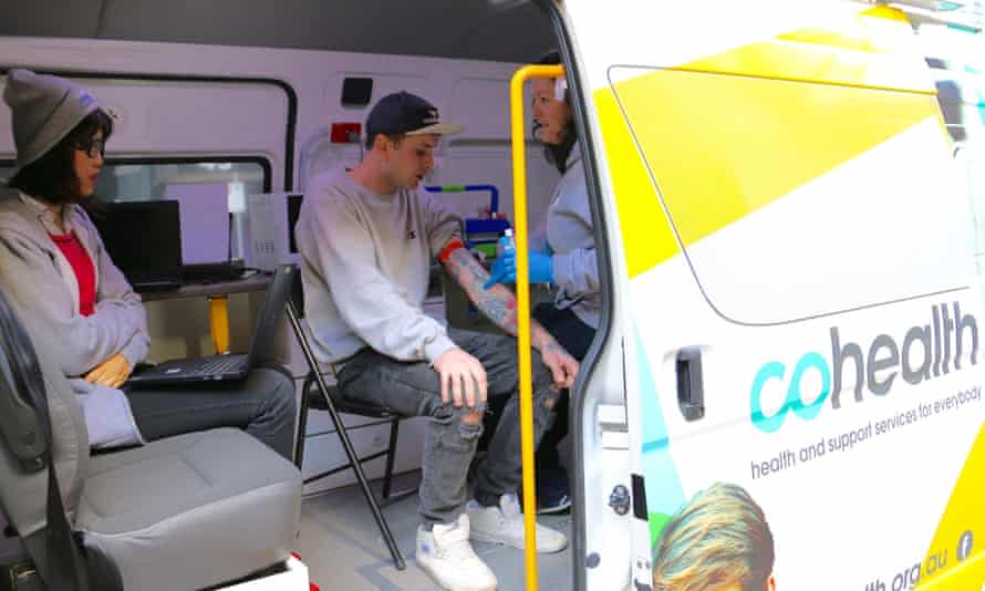 Vaan Phongsavan (left) working on cohealth’s street doctor service before the program finished.