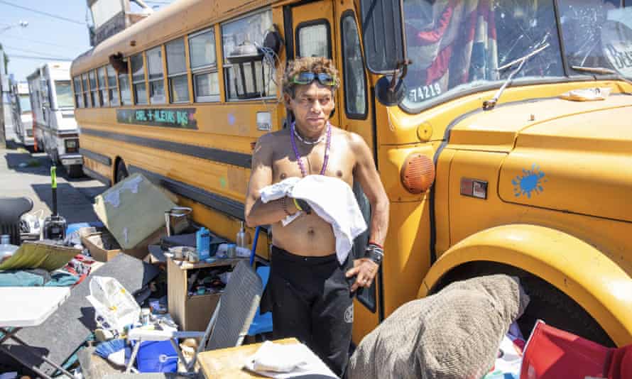 Jose Ortiz tried to keep cool outside his school bus home in the Sodo neighborhood of Seattle during a record-breaking heat wave.