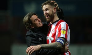 Thomas Frank celebrates victory over Cardiff with Pontus Jansson, who was the oldest outfield player Brentford signed in four years.