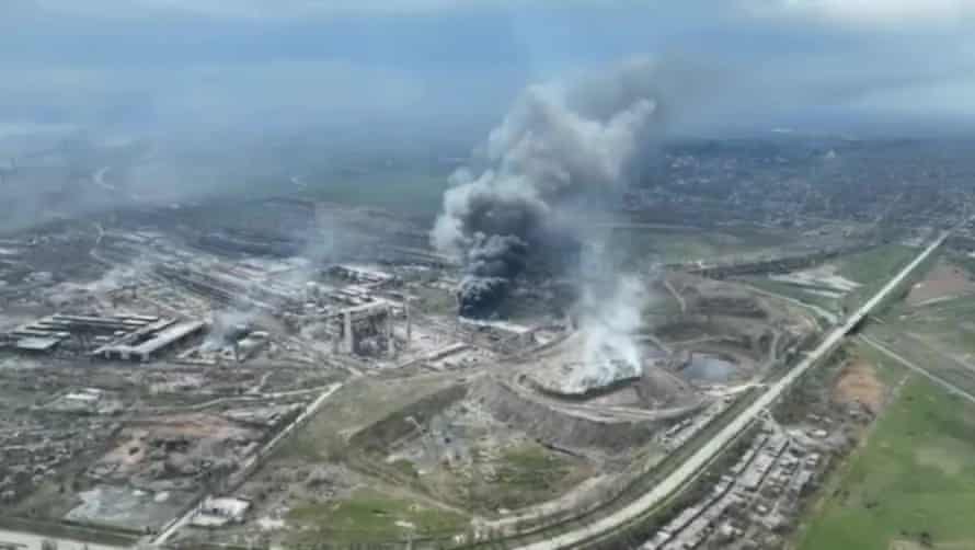 A frame grab from an undated handout drone video first published by DPR militia commander Alexander Khodakovsky and made available by the Mariupol City Council shows smoke rising from the Azovstal steel plant during airstrikes in Mariupol, eastern Ukraine