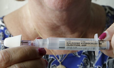 High school nurse Kathleen Gage holds a nasal administered dose of Narcan in Warwick, Rhode Island.