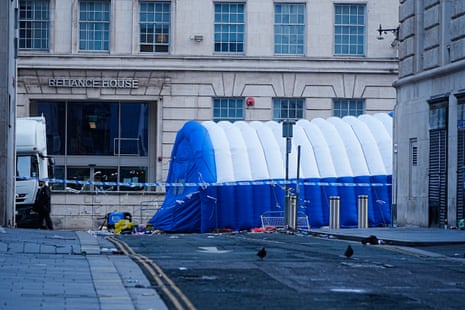 A blue tent and police tape along a road in Liverpool