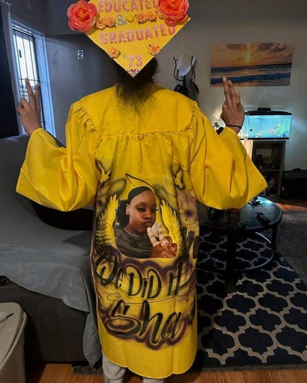 A friend of Shamara Young’s with an image of her on the back of a graduation gown.