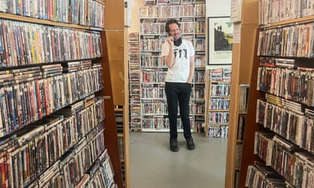 Ben Kenny in his DVD rental store Film Club
