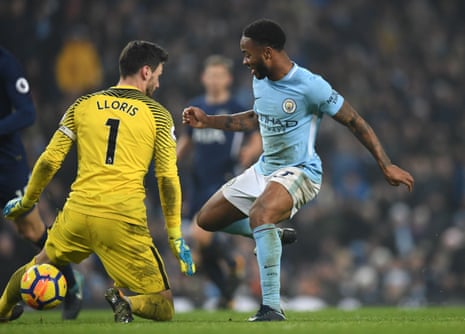 Manchester City’s Raheem Sterling sticks the ball through the legs of Spurs keeper Hugo Lloris to score their fourth goal.