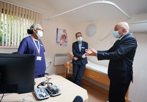 Sajid Javid, the health secretary (right) with Dr Clementine Olenga-Disashi (left) and Dr Ali al-Bassam, during a visit today to the Vale Medical Centre in Forest Hill, south east London.