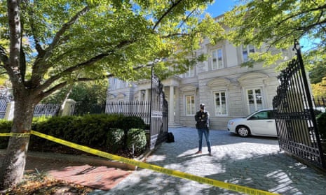 A federal agent stands guard outside the property in Washington on Tuesday morning.