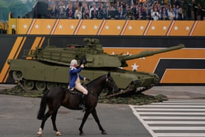 President Donald Trump attends a military parade commemorating the Army’s 250th anniversary, coinciding with his 79th birthday, in Washington