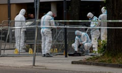 Forensic officers at the scene of the shooting