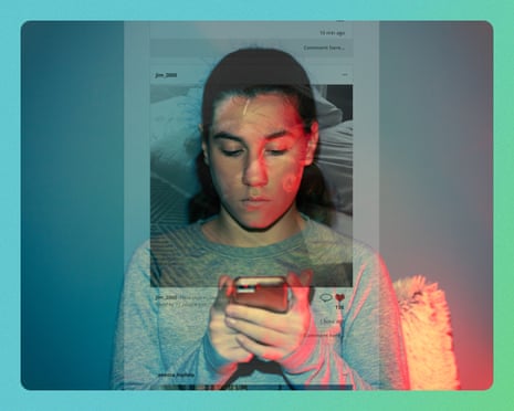A person looks down at a smartphone while lying in bed, with projected light illuminating their face