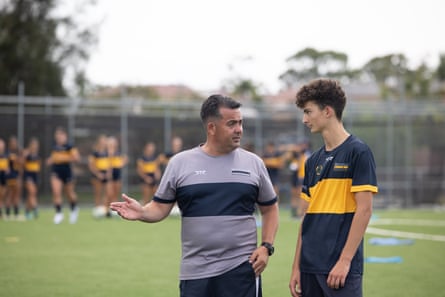 Babington speaks with a student during a training session.