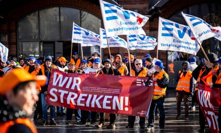 Members of the EVG union protest outside the main train station in Bremen on Monday.