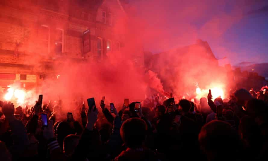 Liverpool fans let off flares outside the stadium before the match.